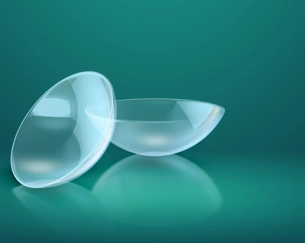 Contact lenses on a teal background, illustrating options for eye care and fitting services at Eyes On Park optometry practice.